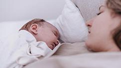 A baby and a mother s sleeping on Elviros pillows