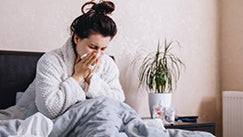 A perosn with cold is sitting on Elviros mattress