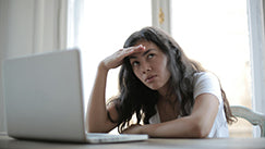 A woman is sleepy at work